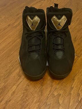 Jordan Black Basketball Sneakers with Gold Tongue Accents